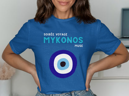 Blue t-shirt with "Soirée Voyage Mykonos Muse" and an evil eye design.