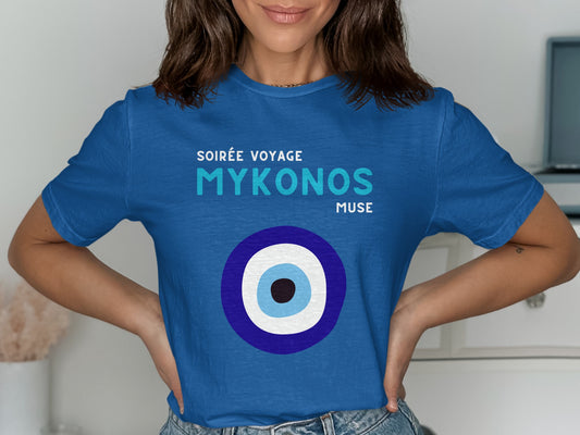 Blue t-shirt with "Soirée Voyage Mykonos Muse" and an evil eye design.