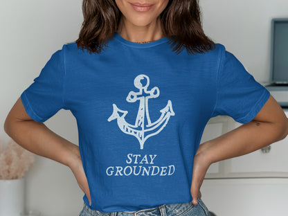 Blue t-shirt with white anchor and "STAY GROUNDED" text.
