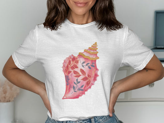 White t-shirt with a pink seashell design featuring blue floral accents.