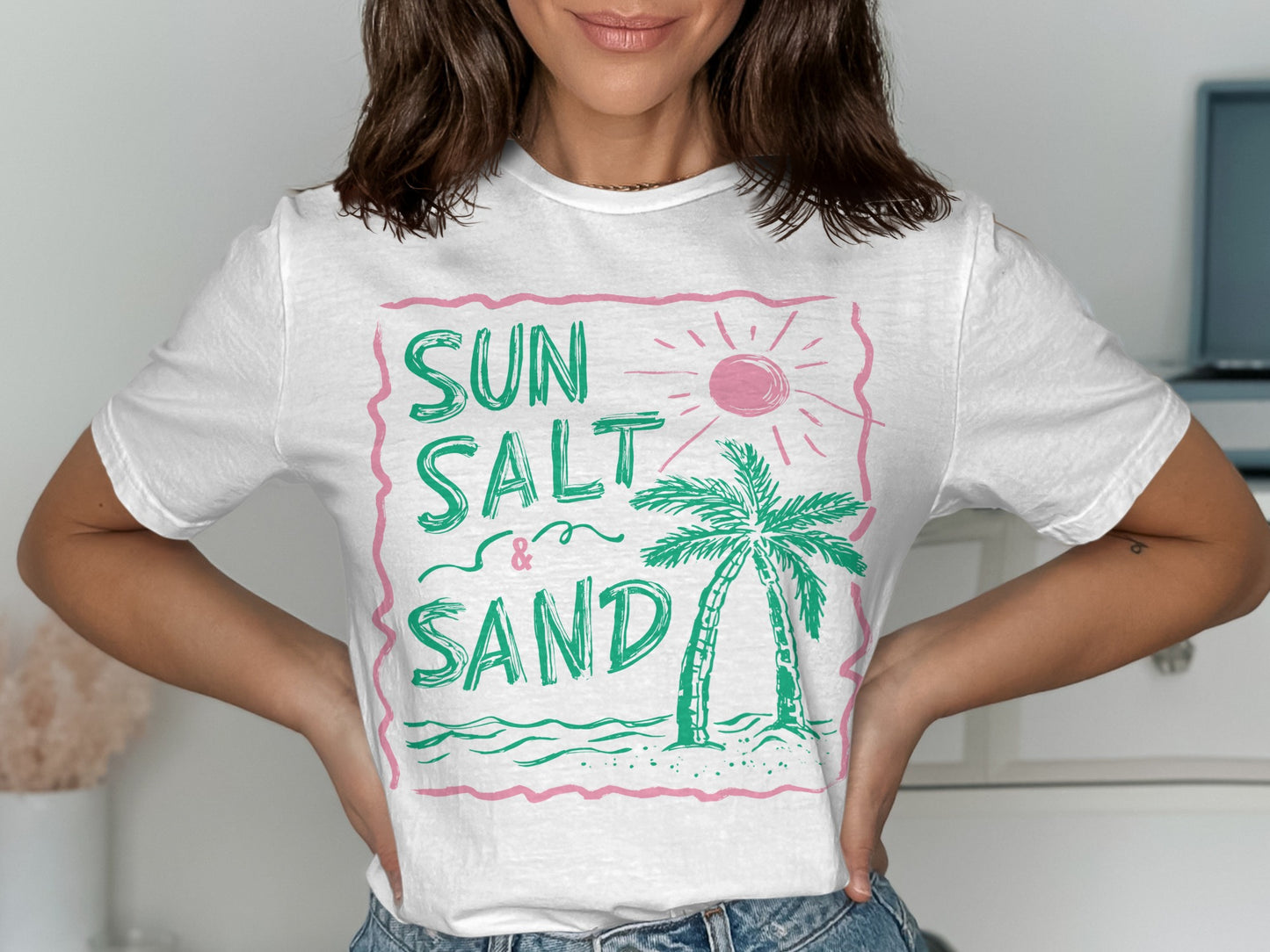 White t-shirt with "SUN SALT & SAND" and a palm tree design.