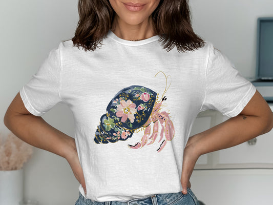 White t-shirt with a colorful hermit crab and floral shell graphic.