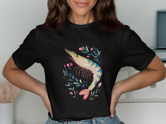Black t-shirt featuring a colorful shrimp illustration surrounded by floral branches.
