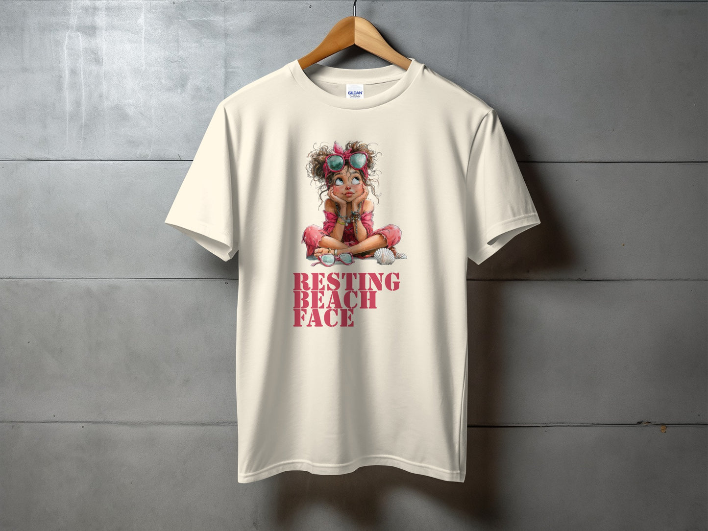 Cream t-shirt with cartoon girl and text "Resting Beach Face".