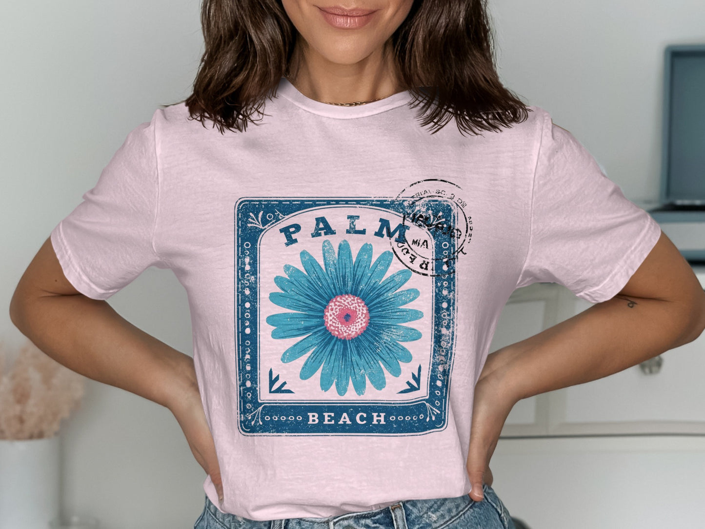 Pink t-shirt with blue floral design and "PALM BEACH" text.