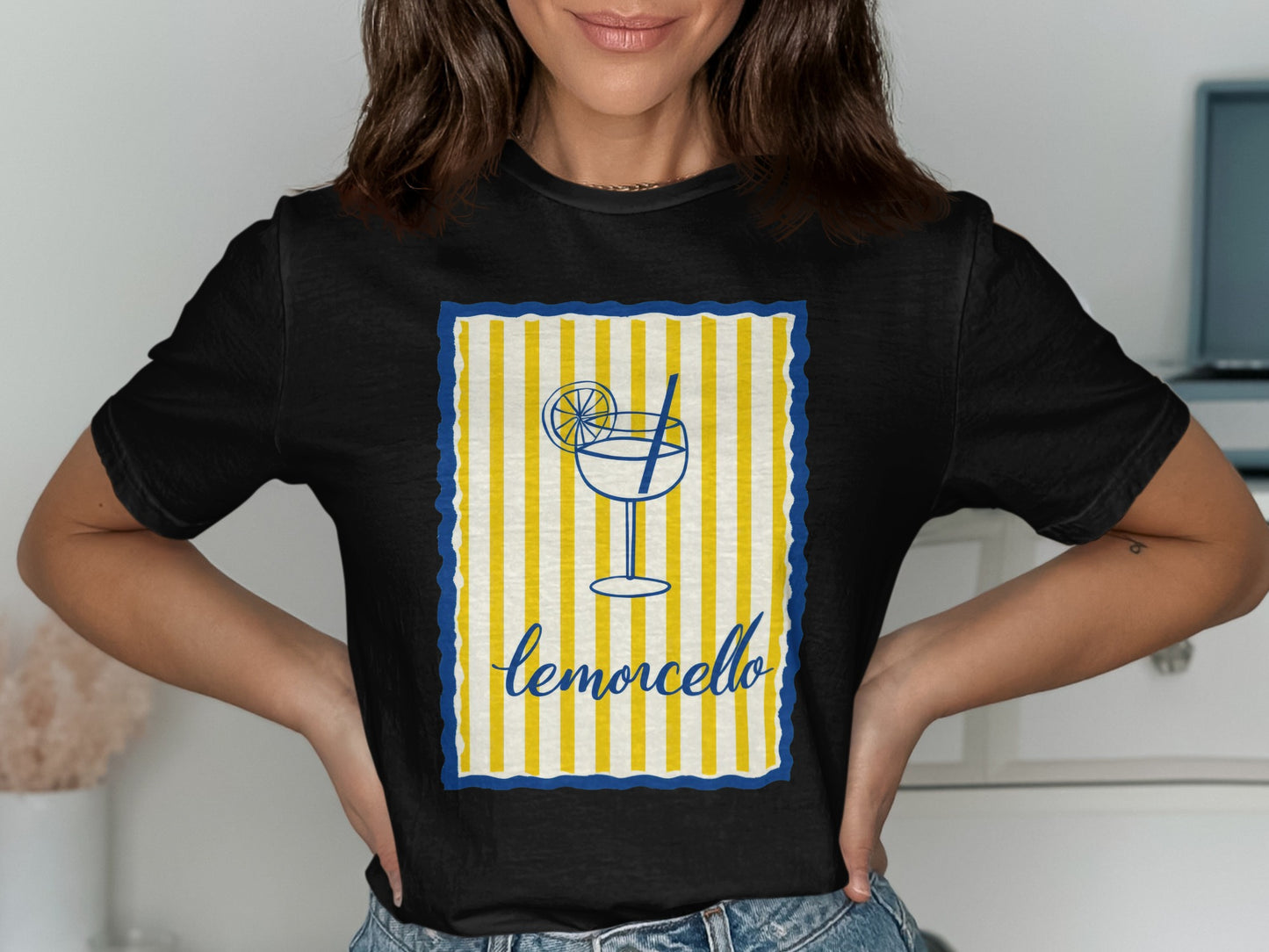 Black t-shirt with a limoncello graphic featuring a glass, lemon slice, and striped border.