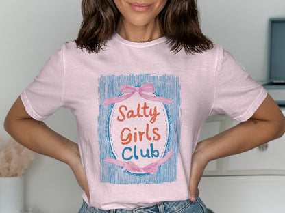 Pink t-shirt with "Salty Girls Club" text and ribbon graphic.