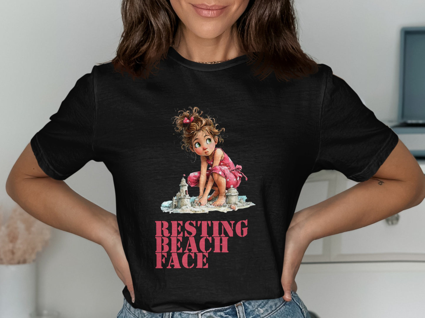 Black t-shirt with graphic of girl at beach, "RESTING BEACH FACE" text.