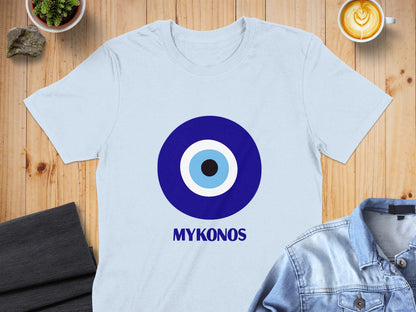 Light blue t-shirt with a large blue and white evil eye symbol and "MYKONOS" text.