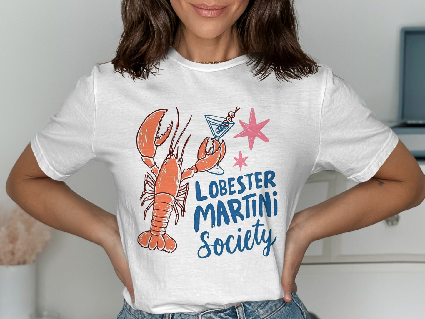 White t-shirt with lobster, martini glass, and "Lobster Martini Society" text.