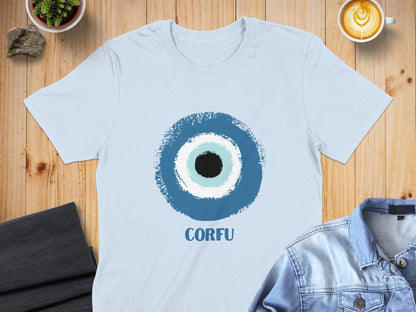 Light blue t-shirt with a blue and white evil eye design and "CORFU" text.
