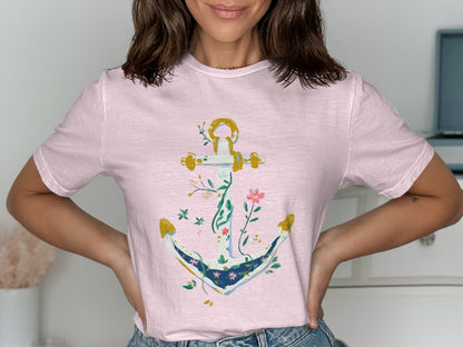 Pink t-shirt with an anchor design featuring floral and vine accents.