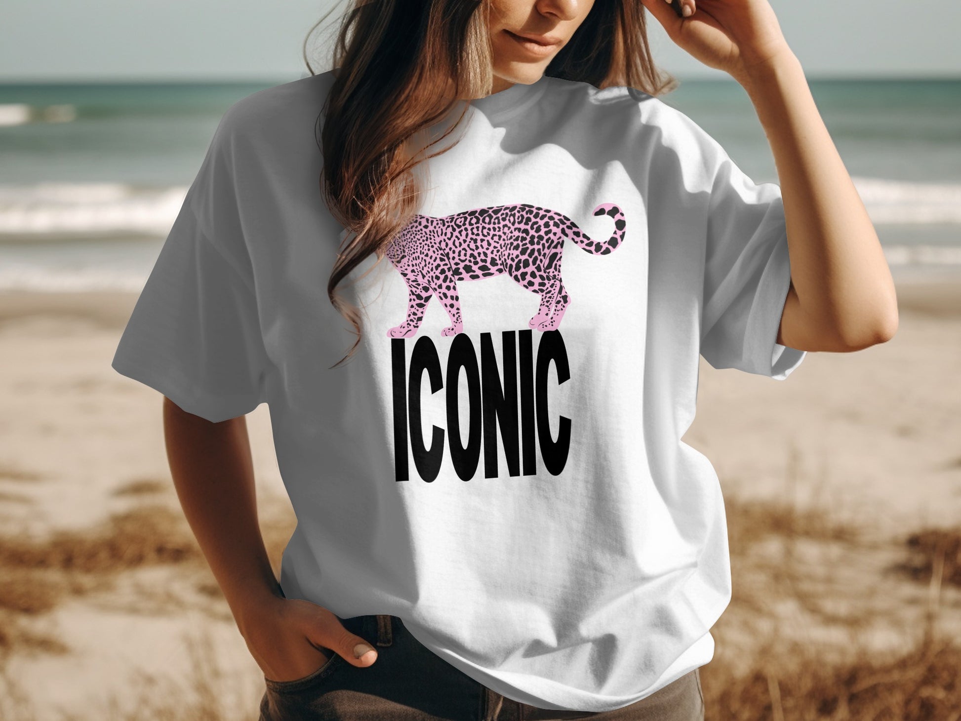 White t-shirt with a pink leopard and "ICONIC" text.