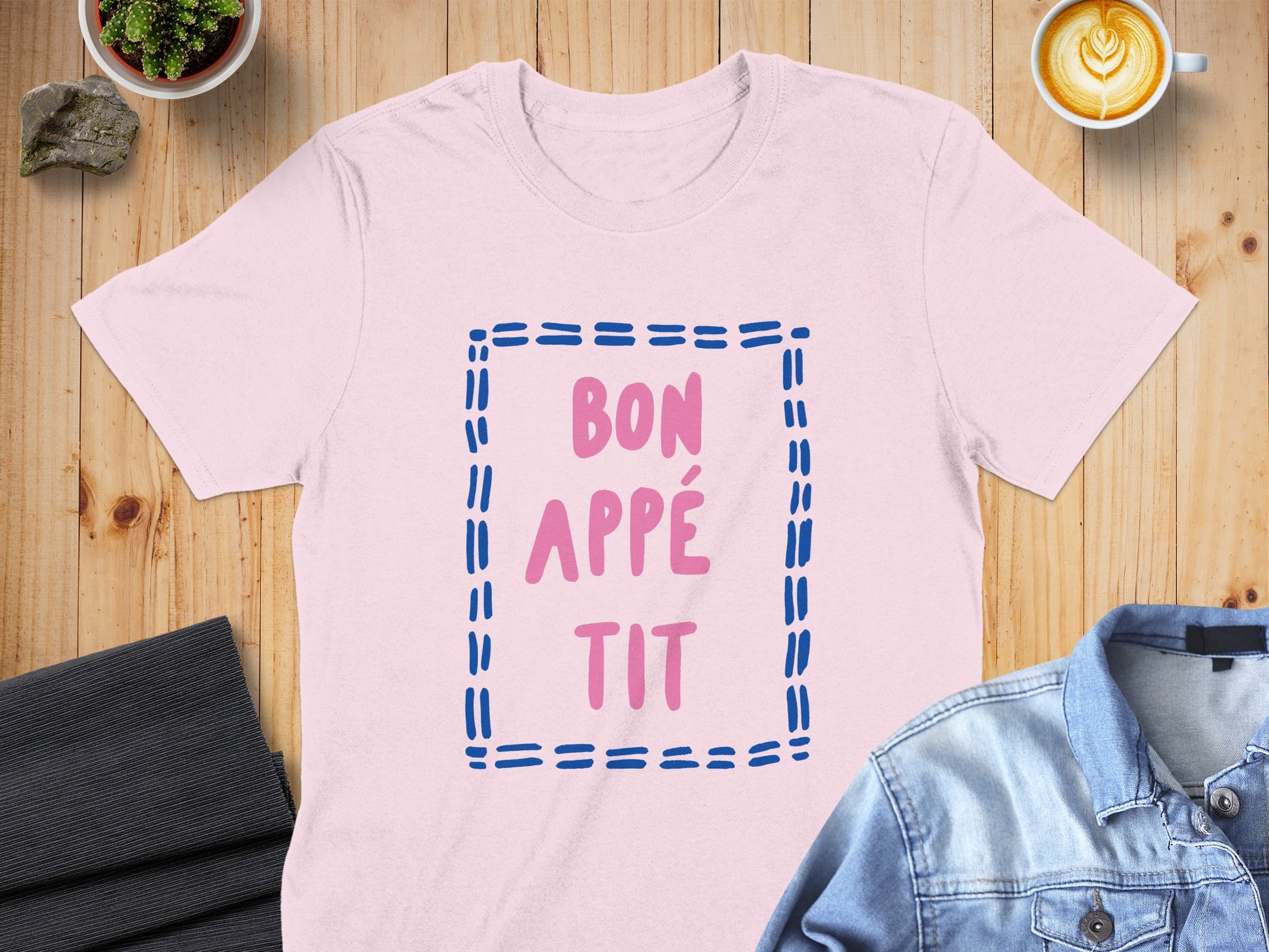 Pink t-shirt with "BON APPÉ TIT" text in blue outlined letters.
