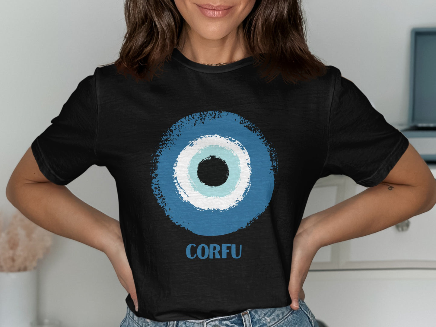 Black t-shirt with a blue and white evil eye design and "Corfu" text.