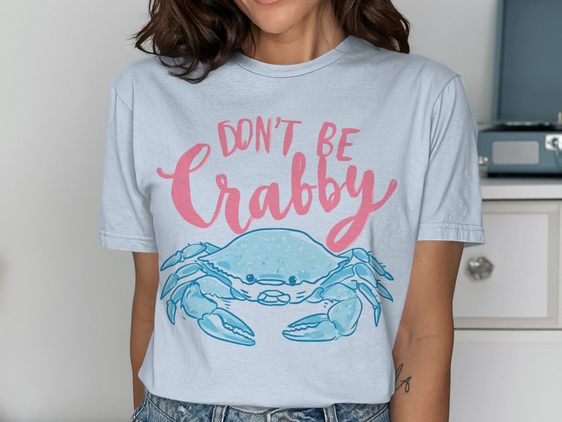 Light blue t-shirt with "DON'T BE Crabby" and a blue crab graphic.