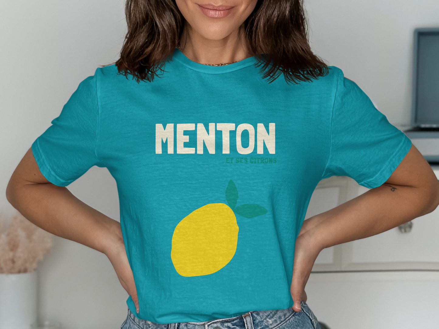 Teal t-shirt with yellow lemon graphic and "MENTON ET SES CITRONS" text.