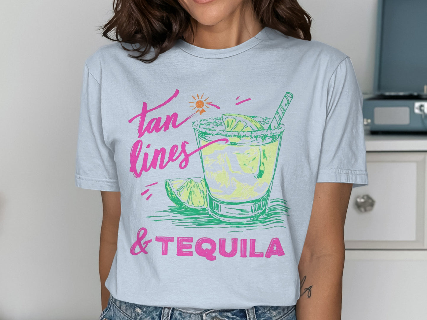 T-shirt with "Tan Lines & Tequila" text and margarita illustration.