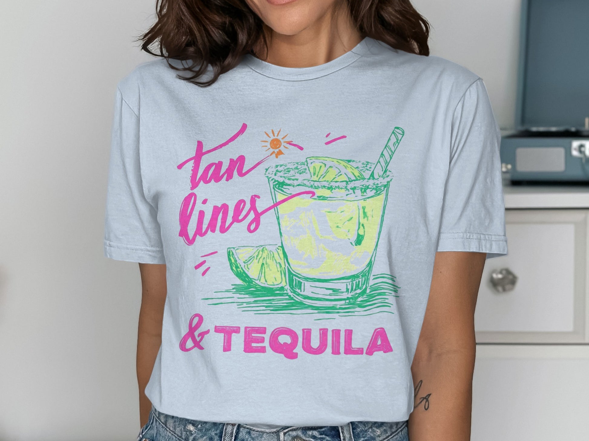 T-shirt with "Tan Lines & Tequila" text and margarita illustration.