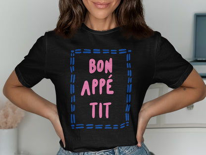 Black t-shirt with pink "BON APPÉTIT" text within a blue dashed square.