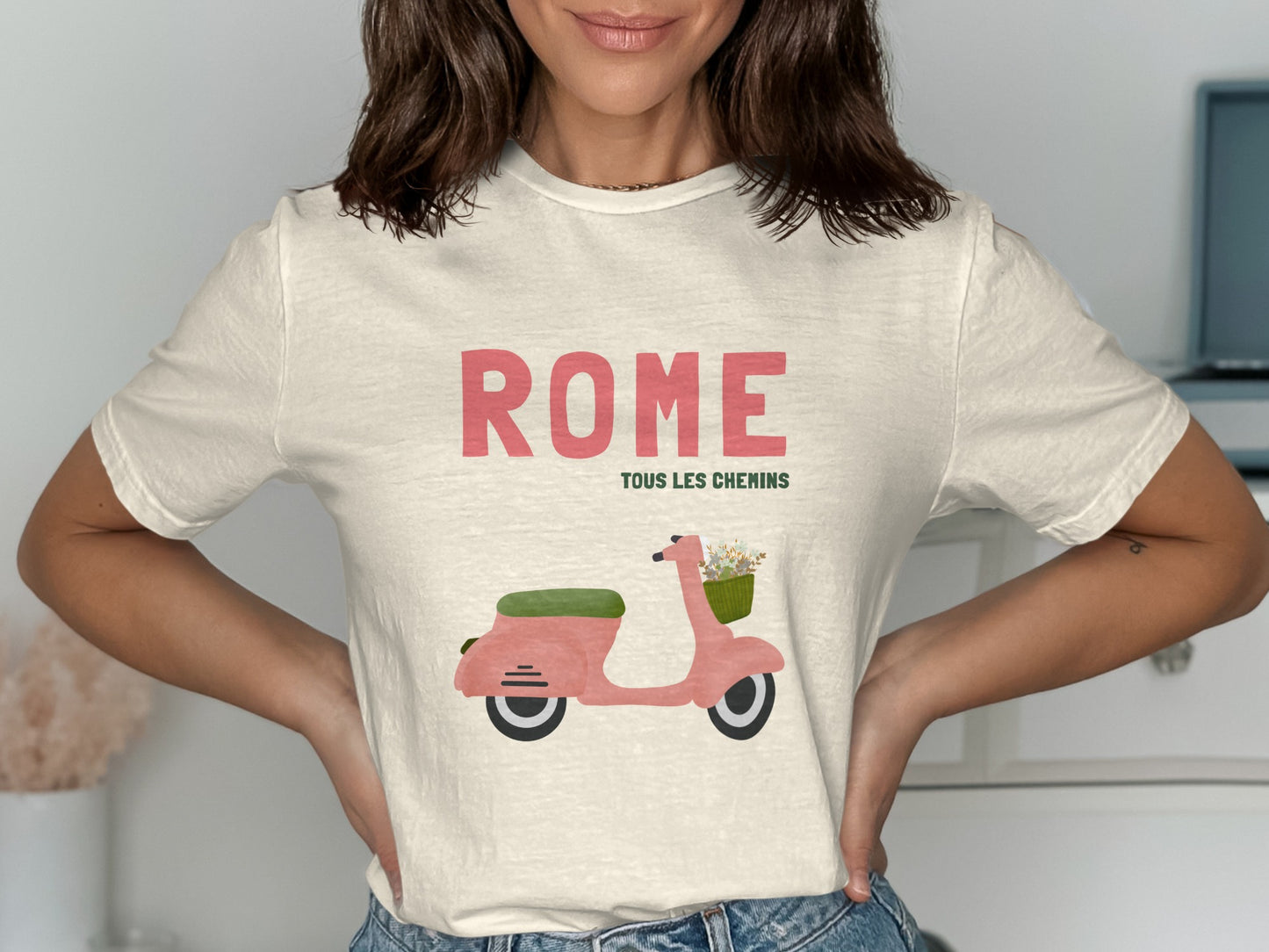 Cream t-shirt with pink scooter graphic and "Rome Tous Les Chemins" text.