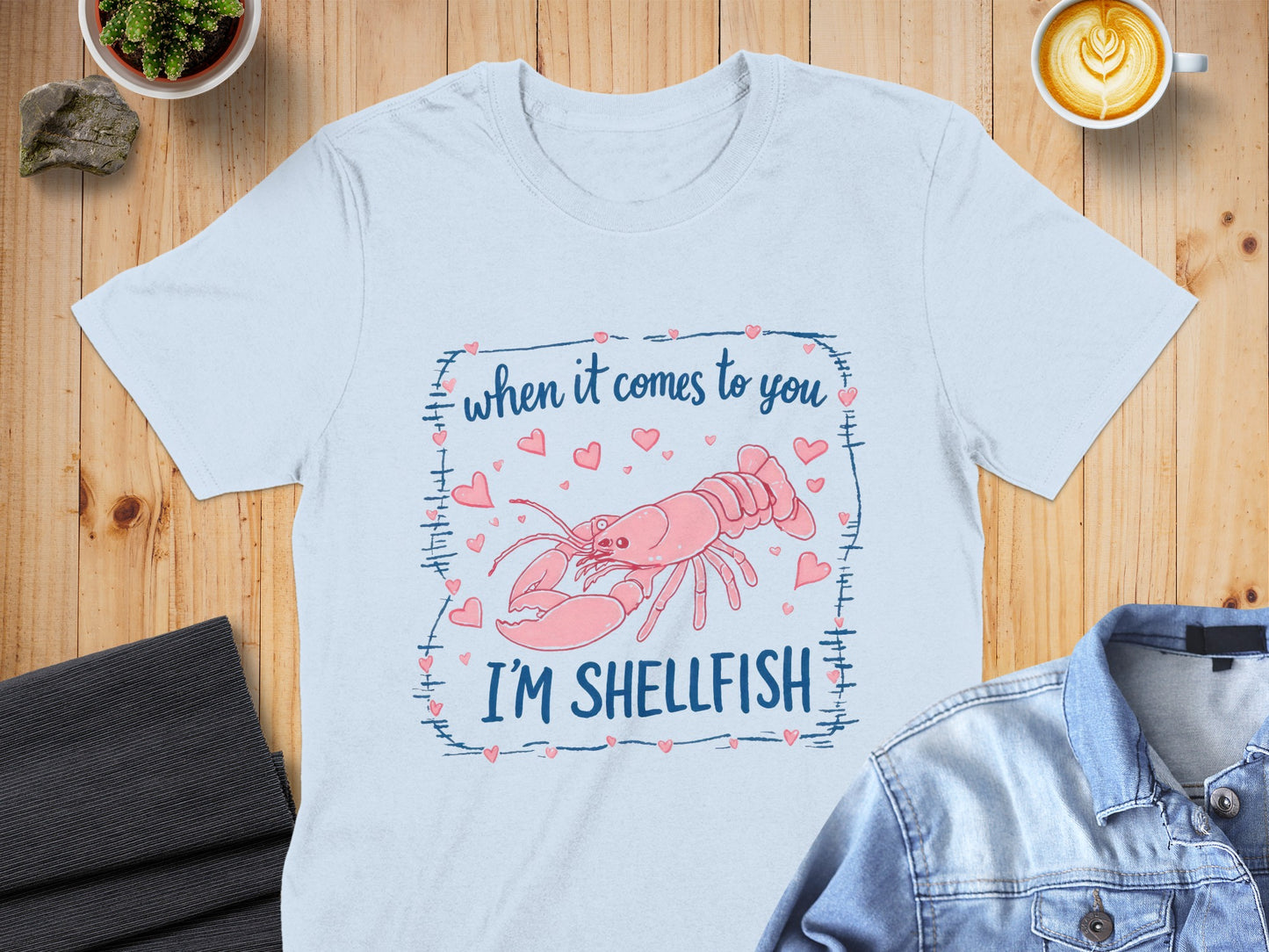 Light blue t-shirt with pink lobster and text "when it comes to you I'M SHELLFISH".