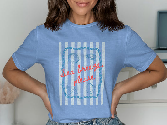 Light blue t-shirt with "Sea breeze, please" and seashell design.
