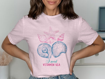 Pink t-shirt with seashells and "I need vitamin sea" text.