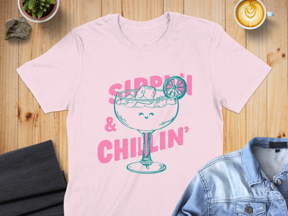 Pink t-shirt with cartoon margarita "Sippin' & Chillin'" graphic.