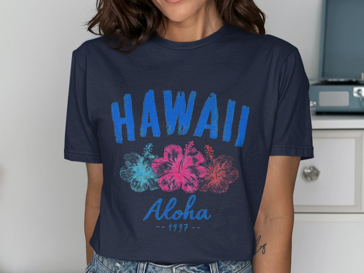 Navy t-shirt with "HAWAII Aloha 1997" and hibiscus flowers.