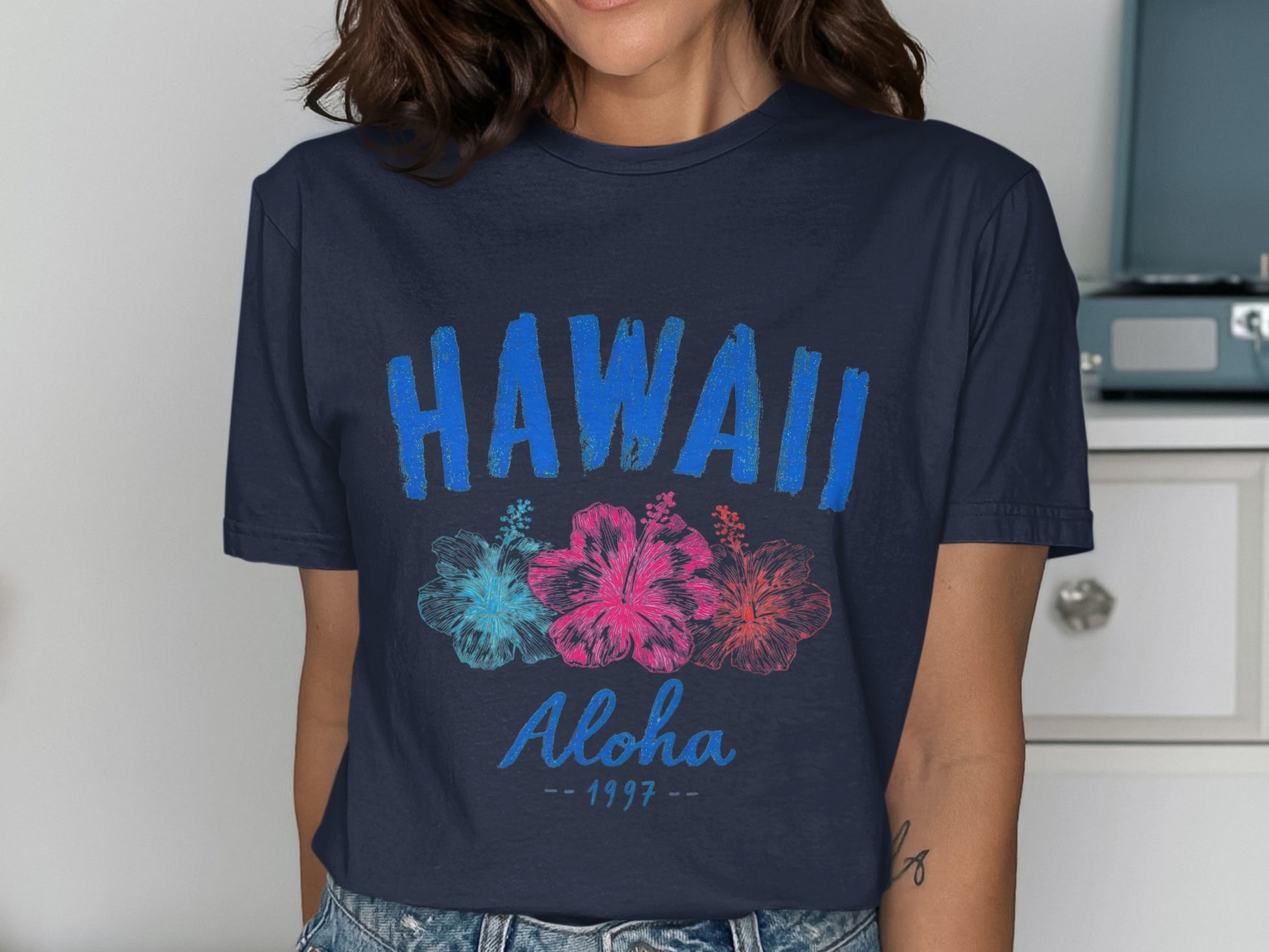 Navy t-shirt with "HAWAII Aloha 1997" and hibiscus flowers.