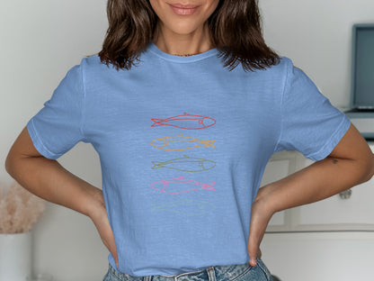 Blue t-shirt with four colorful fish outlines in horizontal alignment.