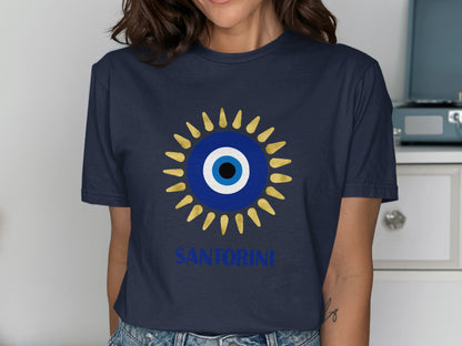 Navy t-shirt with a blue and gold evil eye design and "Santorini" text.