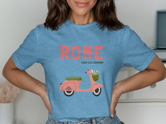 Blue t-shirt with "ROME TOUS LES CHEMINS" and a pink scooter graphic.