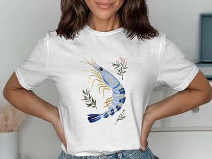 White t-shirt with a blue shrimp and pink floral illustration.