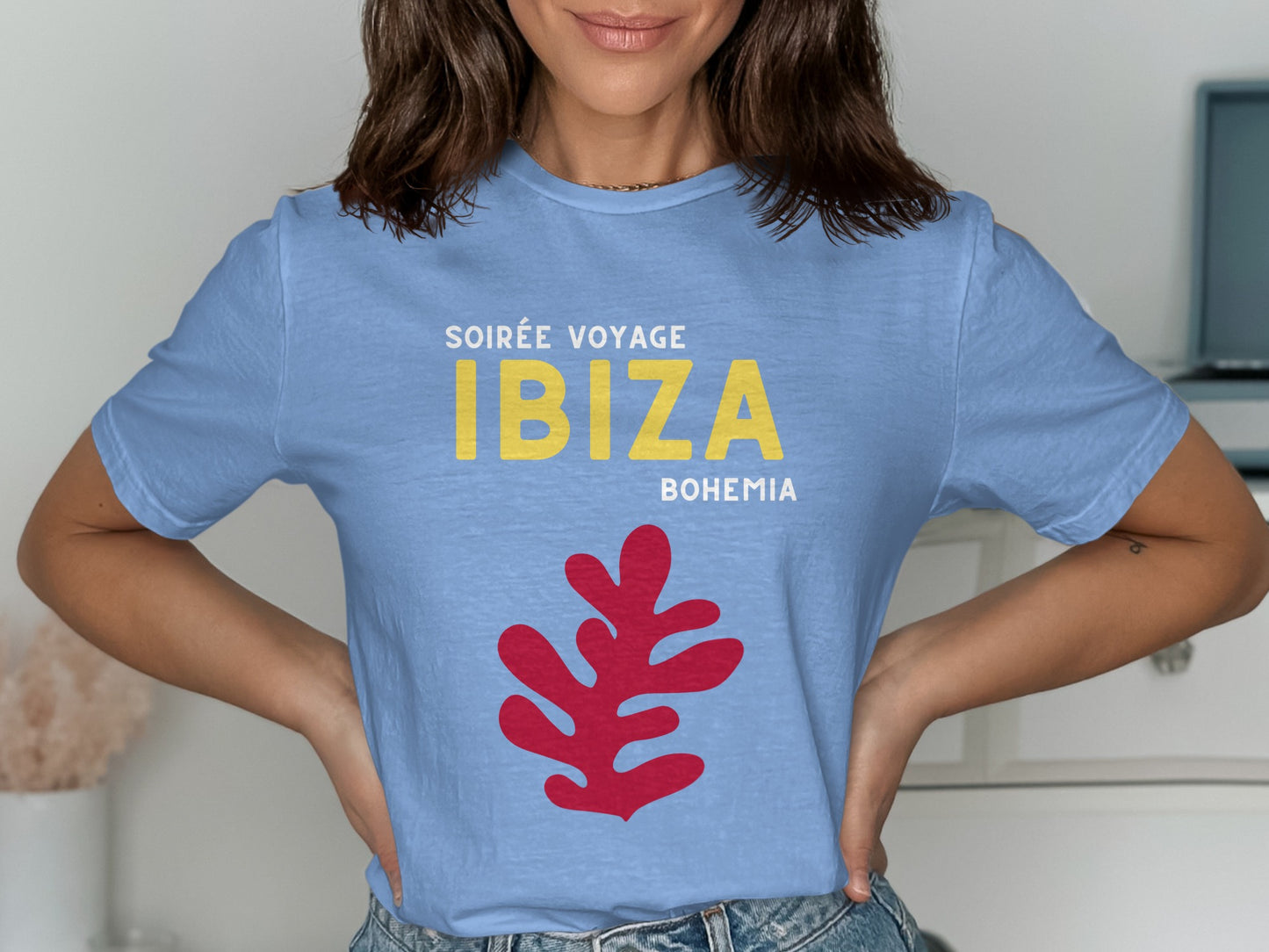 Light blue t-shirt with "SOIREE VOYAGE IBIZA BOHEMIA" text and red abstract graphic.
