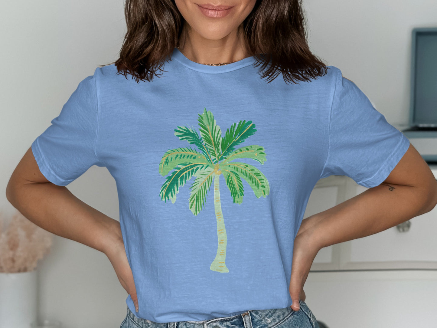 Light blue t-shirt with a watercolor palm tree graphic.