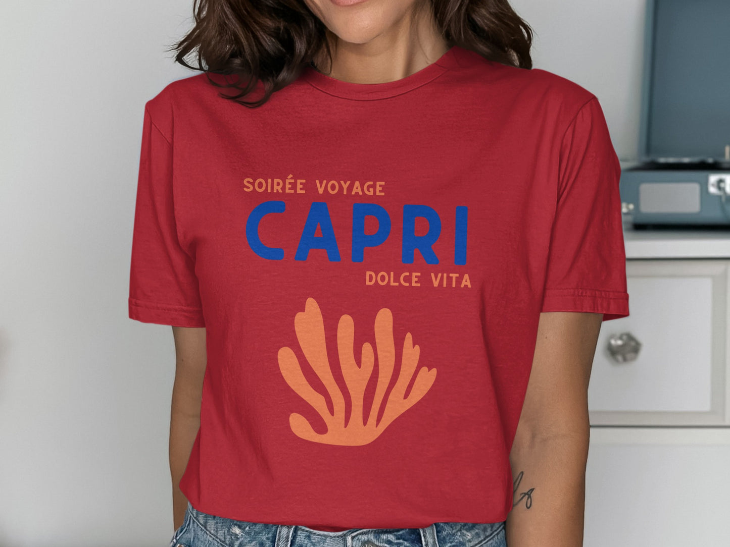 Red t-shirt with "CAPRI DOLCE VITA" and coral graphic.