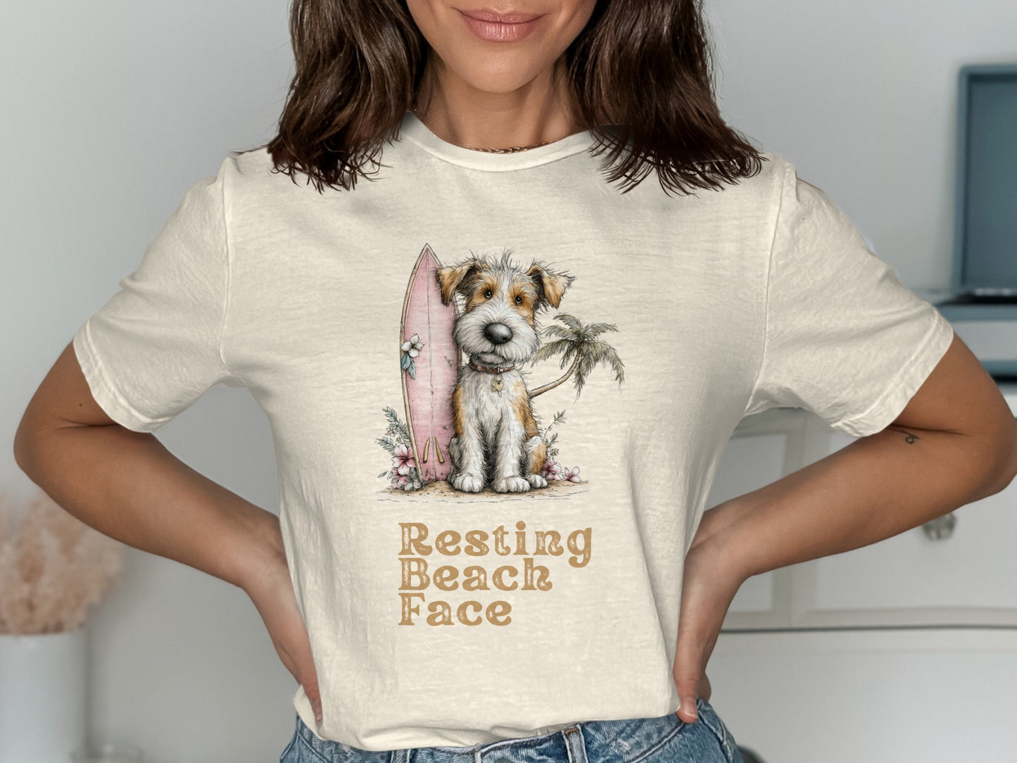 Dog wearing a flower lei on a beach with a surfboard and palm tree.