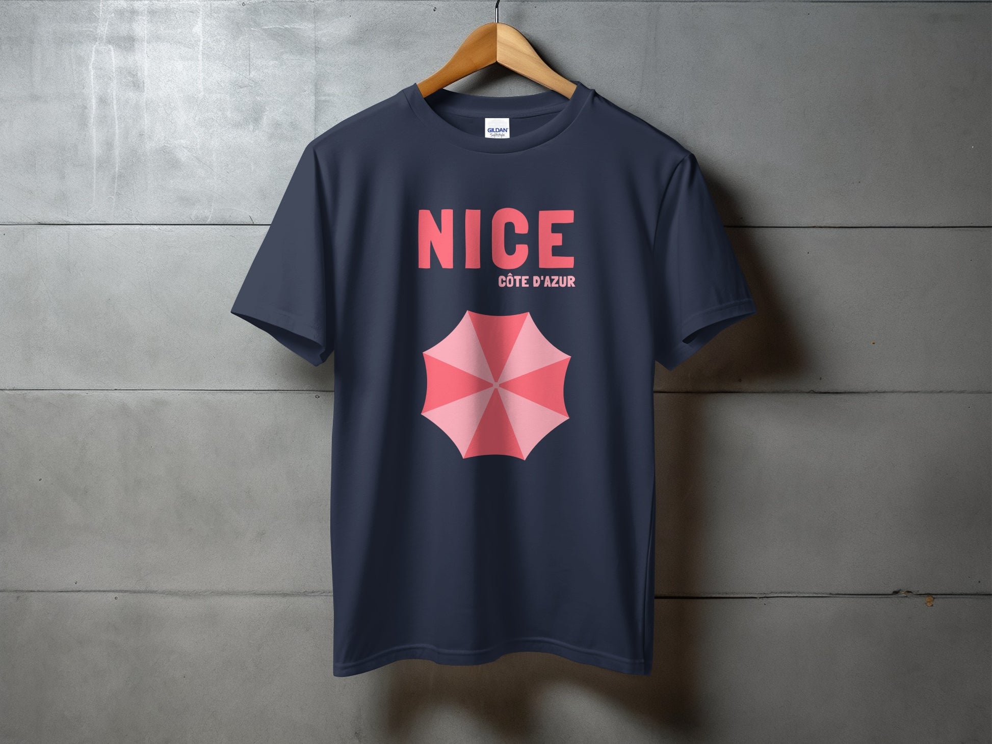 Navy t-shirt with pink umbrella graphic and "NICE CÔTE D'AZUR" text.