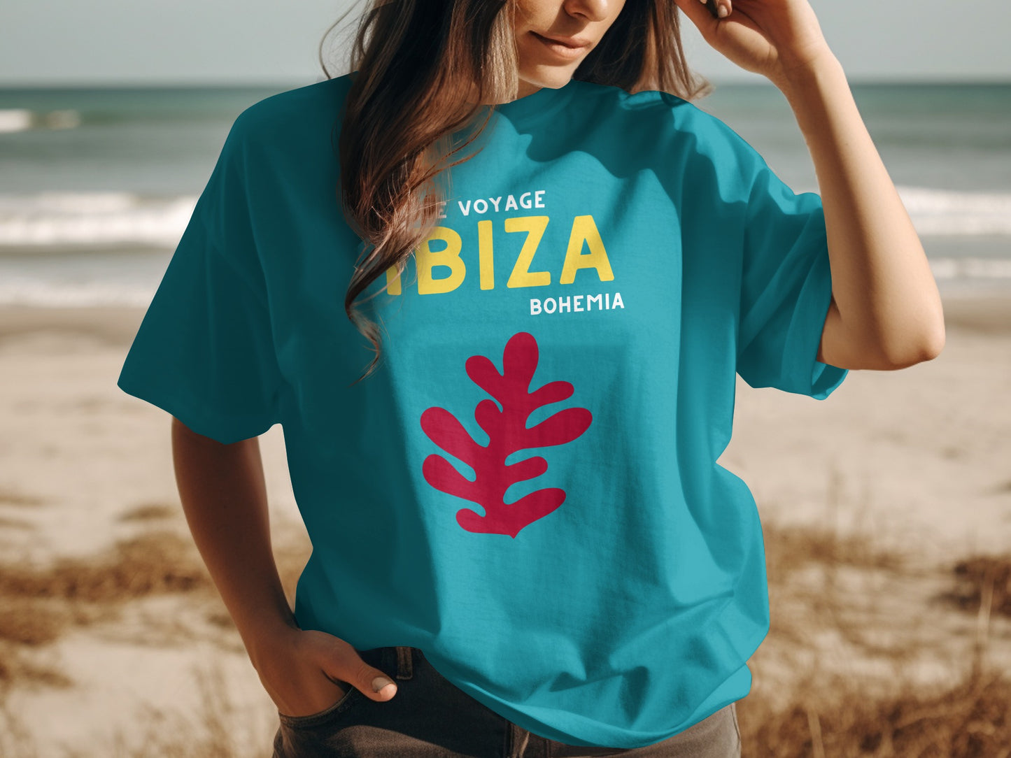 Turquoise t-shirt with "Le Voyage Ibiza Bohemia" and red leaf design.