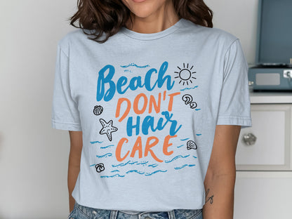 T-shirt with "Beach Don't Hair Care" text and beach-themed graphics.