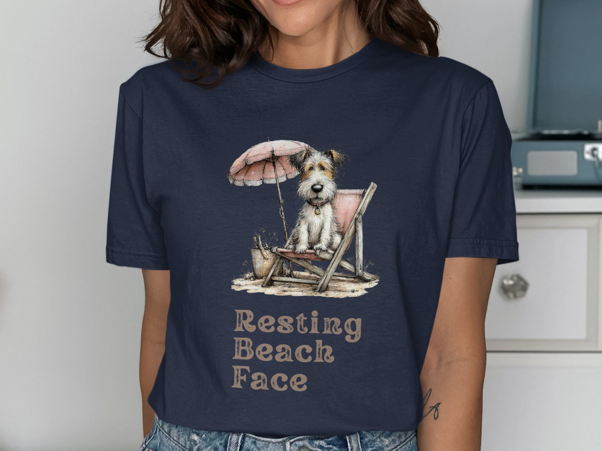 Dog in beach chair under umbrella with text "Resting Beach Face".