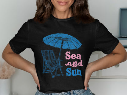 Black t-shirt with a beach chair, umbrella, and "Sea and Sun" text.