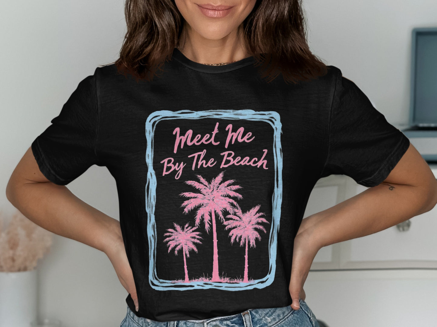 Black t-shirt with pink palm trees and "Meet Me By The Beach" text.