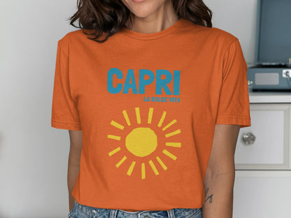 Orange t-shirt with "CAPRI LA DOLCE VITA" and a yellow sun graphic.