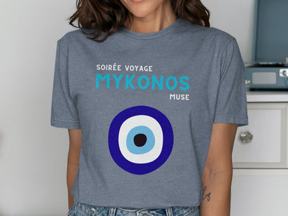 Grey t-shirt with "Soirée Voyage Mykonos Muse" and a blue and white evil eye design.