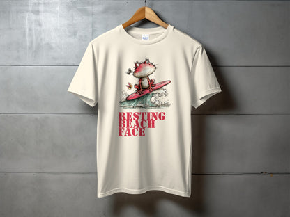 Cream t-shirt with cartoon frog surfing a wave, text "RESTING BEACH FACE".