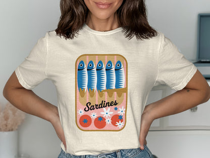 Cream t-shirt with a cartoon illustration of sardines in a can.
