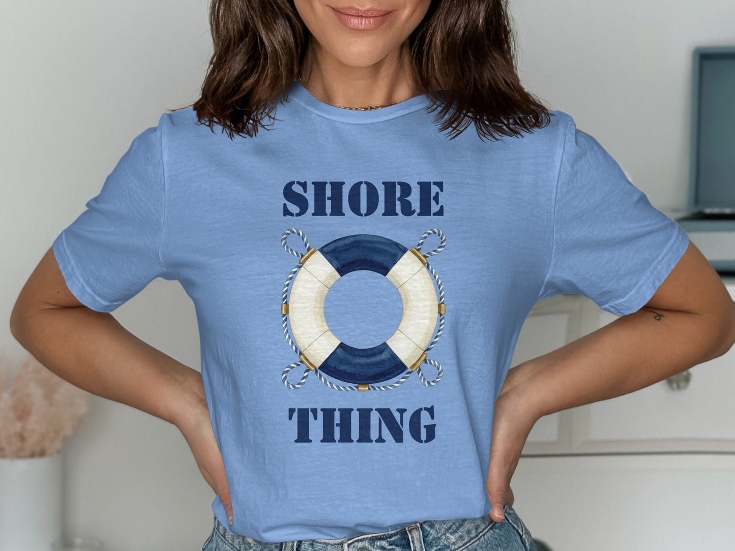 Light blue t-shirt with "SHORE THING" and a nautical life preserver graphic.